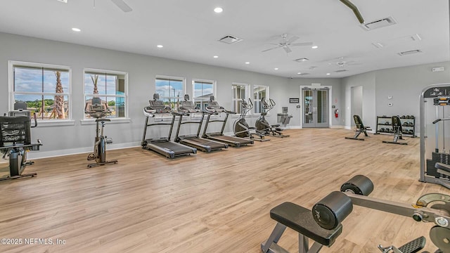 gym featuring light wood-type flooring and ceiling fan