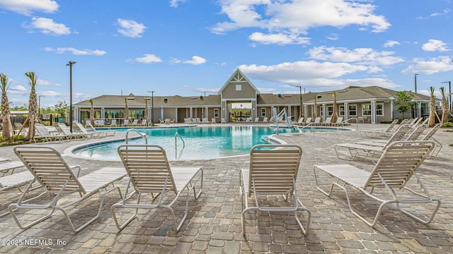 view of swimming pool with a patio