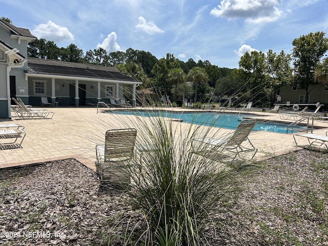 pool with a patio area