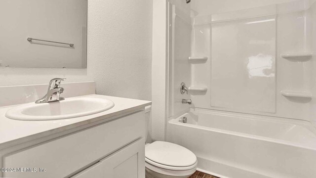 full bathroom with vanity, toilet, and shower / tub combination