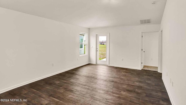 empty room featuring dark hardwood / wood-style floors