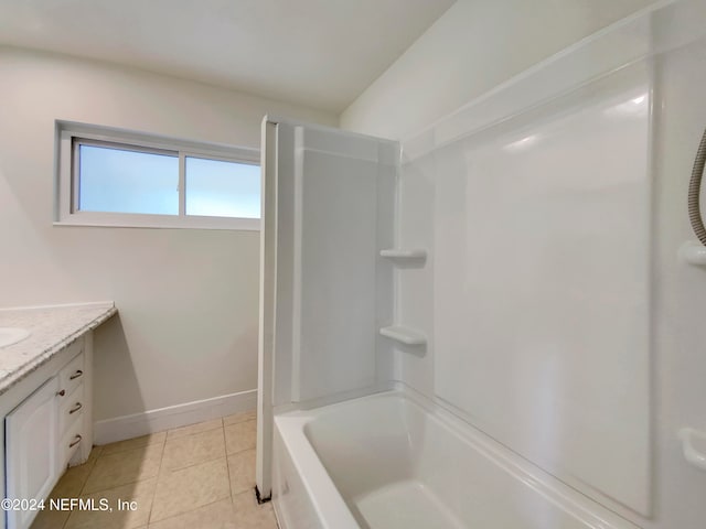 bathroom featuring shower / bathing tub combination, tile patterned floors, and vanity