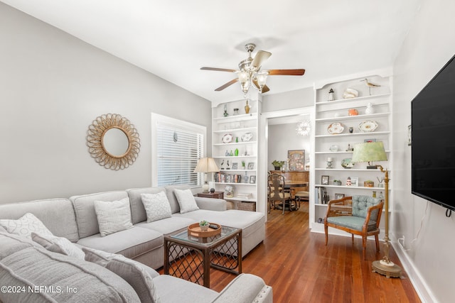 living room featuring ceiling fan and hardwood / wood-style flooring