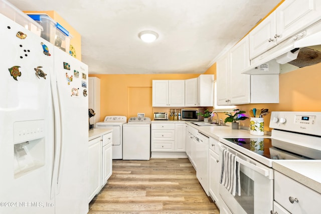 kitchen featuring light hardwood / wood-style floors, sink, white cabinets, white appliances, and independent washer and dryer