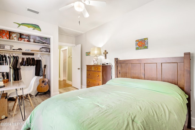 bedroom with light wood-type flooring, a closet, and ceiling fan