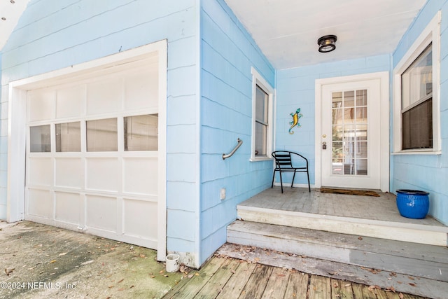 doorway to property with a garage