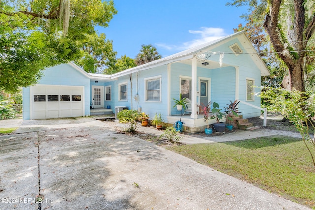 view of front of home with a garage and a front yard