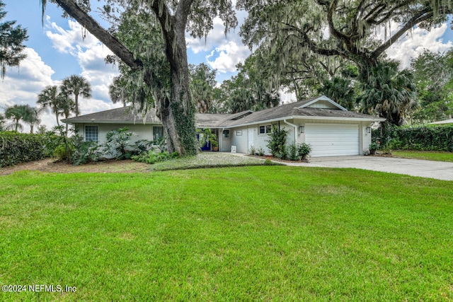 single story home with a garage and a front yard