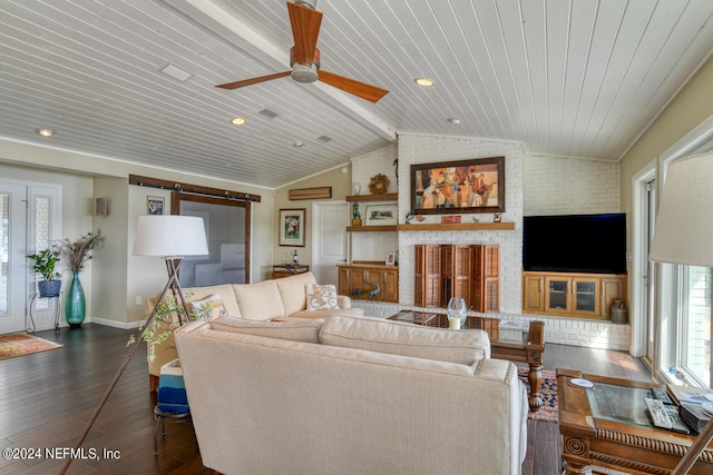 living room featuring ceiling fan, dark hardwood / wood-style floors, wood ceiling, a brick fireplace, and lofted ceiling