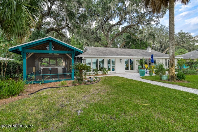 view of front facade featuring a gazebo and a front yard