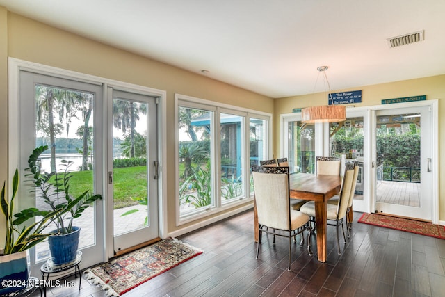 dining room with dark hardwood / wood-style flooring