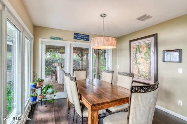 dining space featuring dark hardwood / wood-style flooring