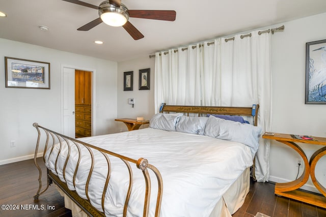 bedroom featuring ceiling fan and dark hardwood / wood-style flooring