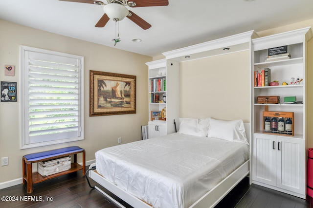 bedroom featuring ceiling fan and dark hardwood / wood-style flooring