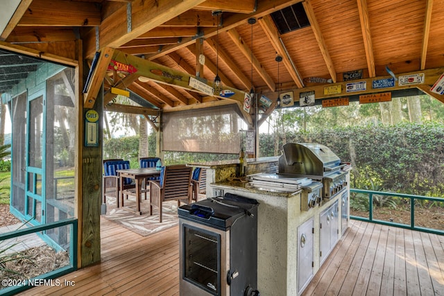 wooden deck featuring area for grilling