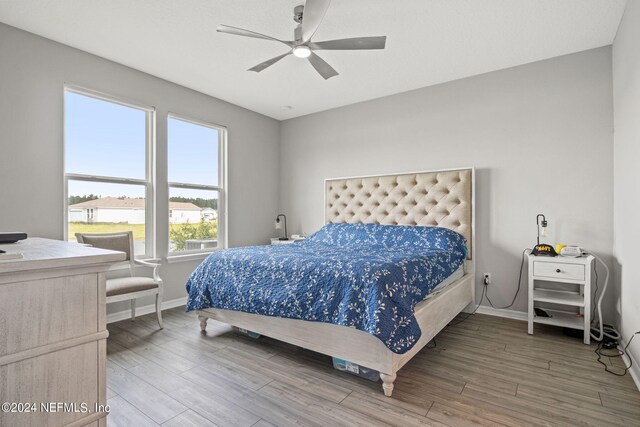 bedroom featuring ceiling fan and wood-type flooring