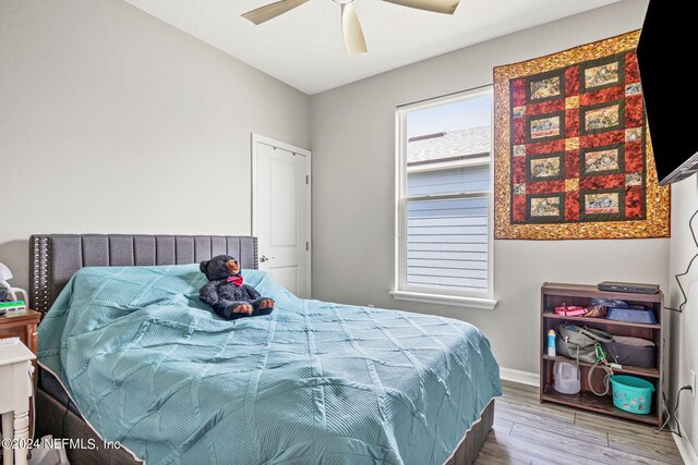 bedroom featuring ceiling fan and hardwood / wood-style floors