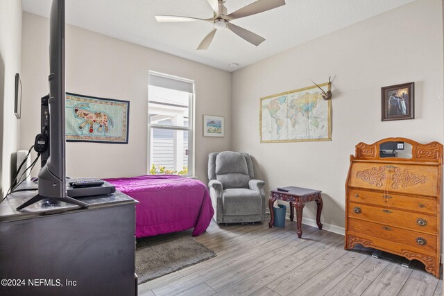 bedroom featuring ceiling fan and light hardwood / wood-style flooring