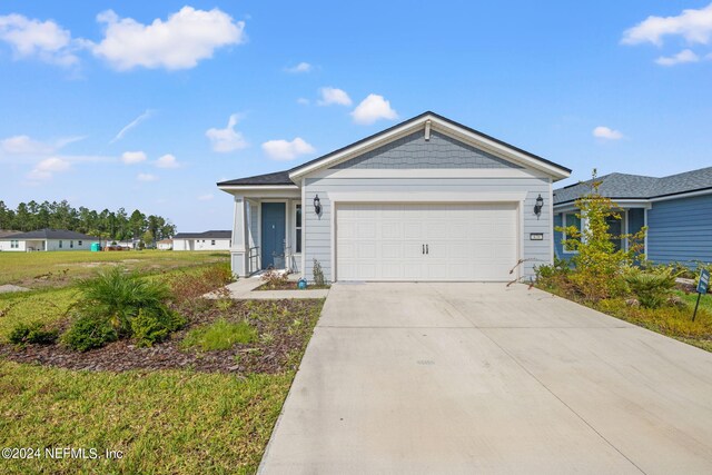 ranch-style house featuring a garage