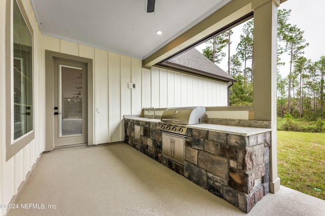 view of patio with a sink, an outdoor kitchen, and area for grilling