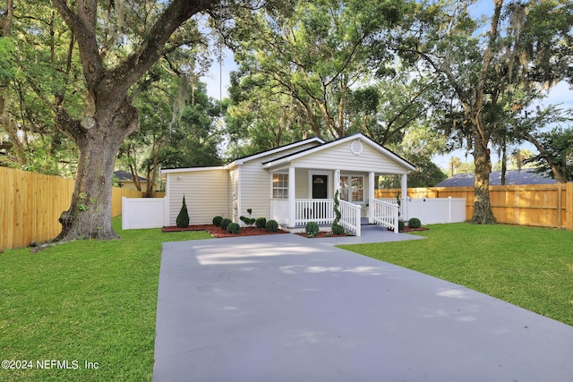 view of front of house featuring a front lawn and a porch