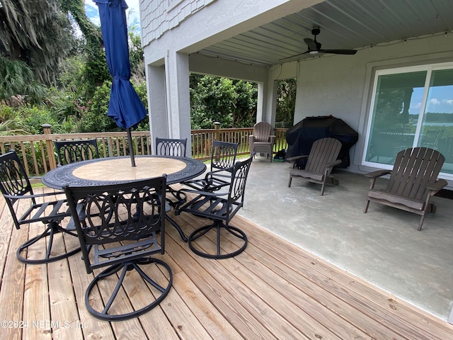 wooden terrace featuring ceiling fan