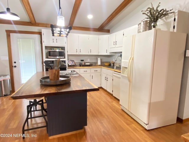 kitchen featuring light hardwood / wood-style floors, pendant lighting, white appliances, and white cabinetry