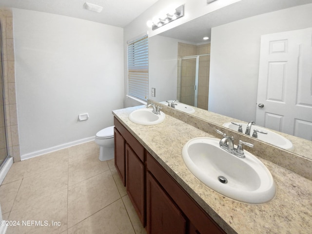 full bathroom featuring a shower stall and a sink