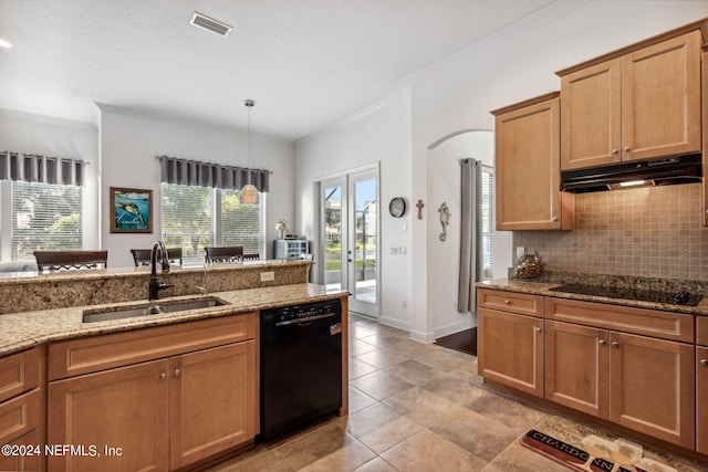 kitchen with light stone countertops, black appliances, under cabinet range hood, and a sink