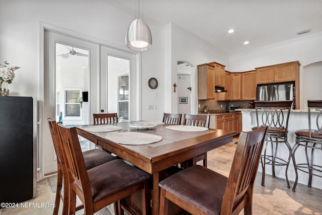 dining room featuring visible vents, arched walkways, crown molding, and recessed lighting