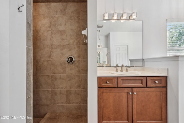 full bath with a walk in shower and vanity