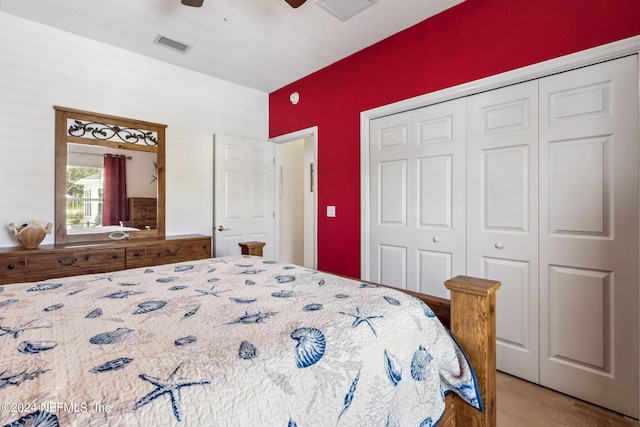 carpeted bedroom with ceiling fan, a closet, and visible vents