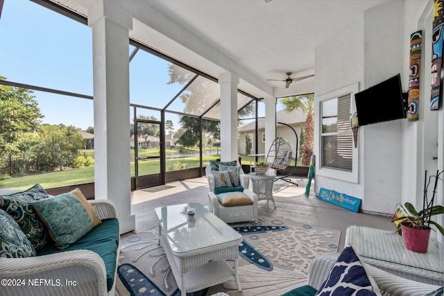 sunroom / solarium with plenty of natural light and a ceiling fan