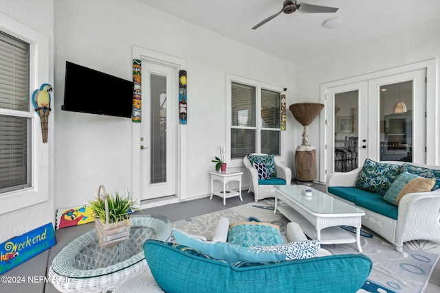 exterior space featuring an outdoor hangout area and a ceiling fan