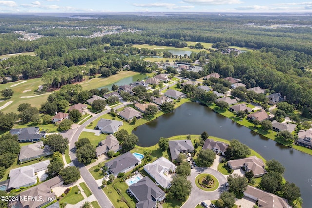 drone / aerial view featuring a residential view and a water view