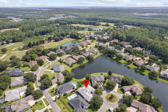 bird's eye view with a water view and a residential view