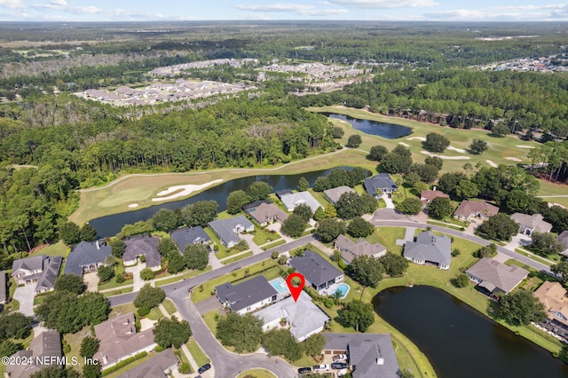 bird's eye view with a residential view and a water view