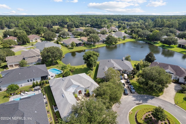 birds eye view of property with a residential view and a water view