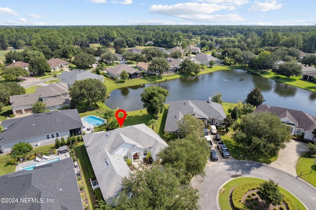 drone / aerial view with a water view and a residential view