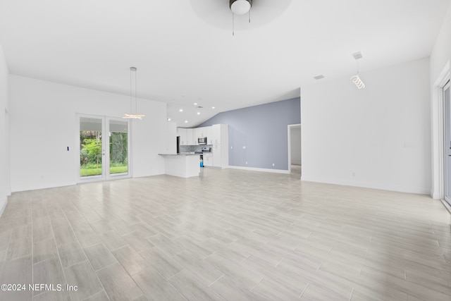 unfurnished living room featuring ceiling fan