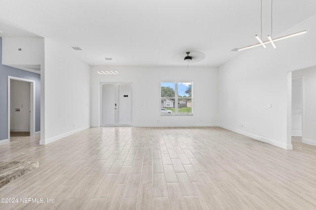 spare room with light wood-type flooring