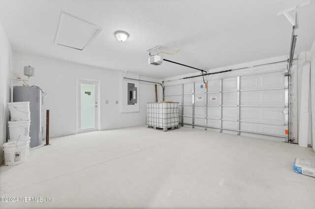 garage featuring a garage door opener, electric panel, and electric water heater