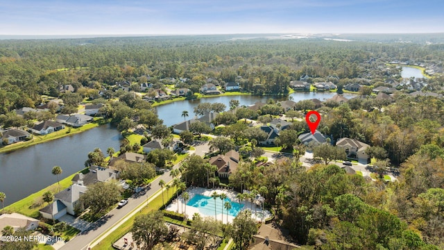 133 Sawmill Lakes Blvd, Ponte Vedra Beach, FL 32082 - aerial perspective of suburban area featuring a heavily wooded area, a large body of water, and a pool