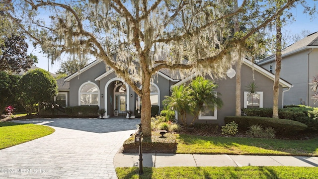 133 Sawmill Lakes Blvd, Ponte Vedra Beach, FL 32082 - view of front facade featuring decorative driveway and stucco siding
