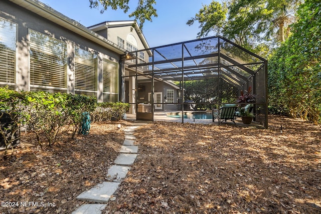 133 Sawmill Lakes Blvd, Ponte Vedra Beach, FL 32082 - back of property with an outdoor pool, stucco siding, a patio area, and a lanai