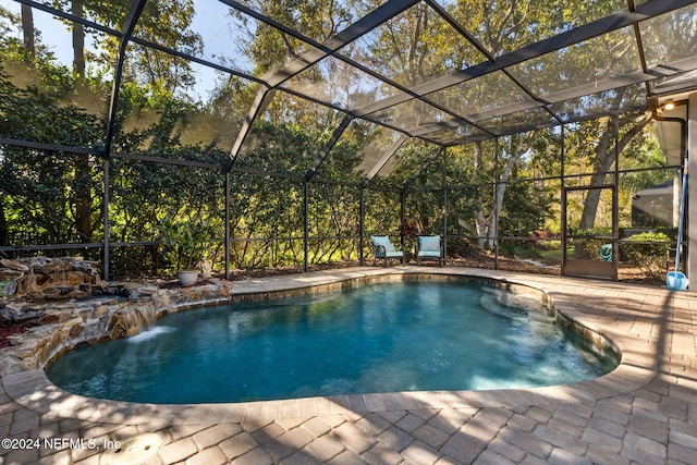 133 Sawmill Lakes Blvd, Ponte Vedra Beach, FL 32082 - outdoor pool featuring a patio and glass enclosure