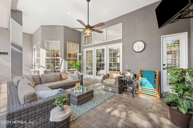 133 Sawmill Lakes Blvd, Ponte Vedra Beach, FL 32082 - living room featuring ceiling fan and a towering ceiling