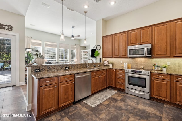133 Sawmill Lakes Blvd, Ponte Vedra Beach, FL 32082 - kitchen with appliances with stainless steel finishes, a sink, and brown cabinets