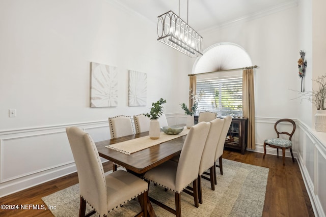 133 Sawmill Lakes Blvd, Ponte Vedra Beach, FL 32082 - dining room with ornamental molding, a chandelier, a wainscoted wall, and wood finished floors
