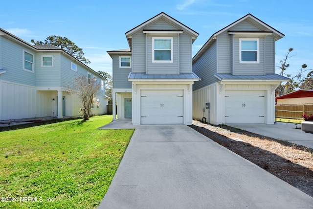 view of front of home with a garage and a front yard